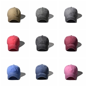 Matrix display of washed cotton baseball caps in nine various colors on white background