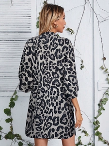 Back view of leopard print long sleeve cardigan showing gray and black pattern details