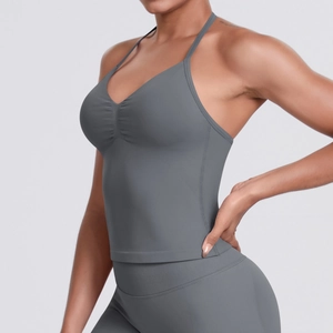 Detailed side view of seamless gray yoga set featuring ribbed crop top and high-waist leggings