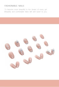 Detailed set of butterfly press-on nails with blue butterfly charms and pearl accents