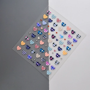 3D relief waffle macaron heart nail stickers with plaid patterns on a split background