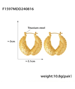 Detailed view of hollow wing feather earrings in 18K gold plated titanium steel