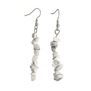Detailed view of natural white stone bead earrings with silver hooks on white background