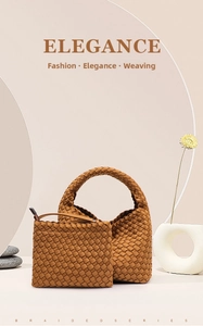 Detail of woven tote bag with matching zippered pouch on minimalist decorative set