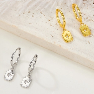 Close-up of S925 silver square heart earrings with star pattern and small diamonds