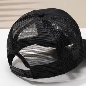 Close-up of black trucker hat breathable mesh back with adjustable snapback closure