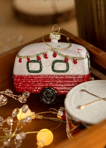 Retro camper van Christmas ornament with festive red texture and glitter details