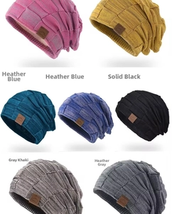 Detail of winter knitted beanies featuring sport leather patch and thick ribbed texture