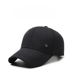 Close-up of black cotton baseball cap showing the silver Z-shaped metal logo detail