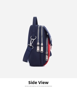 Side view of multi-pocket nylon crossbody bag showing three zipper compartments and handles