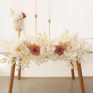 Close-up of artificial rose floral runner in white, champagne and vintage pink for wedding decor