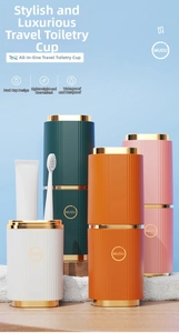 Portable travel toothbrush holder set in four colors with luxury golden trim and striped grip