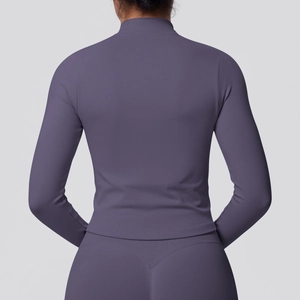 Close-up of seamless dark purple sports jacket featuring ribbed knit texture on the back