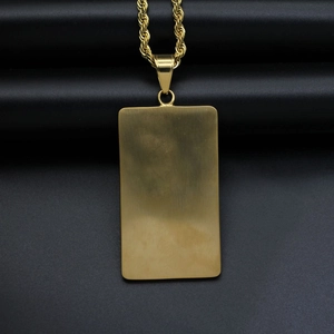 Gold rectangular pendant necklace with twisted rope chain on a sleek black background