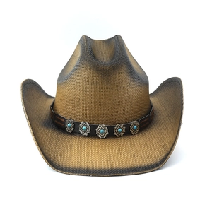 Detail of retro woven straw cowboy hat featuring turquoise stone and silver studs