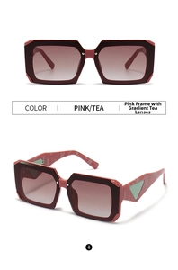 Detail view of rectangular sunglasses with burgundy frames and marble pattern temples