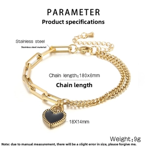 Detail view of a gold-plated stainless steel bracelet with a black heart pendant and chain specs