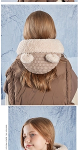 Detail of cute bear-ear knit hat for kids featuring beige fleece and textured brown stitching
