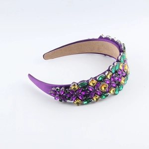 Macro shot of purple baroque headband with multi-color rhinestones on white background