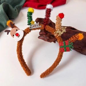 Detail of a plush reindeer antler headband with colorful festive decorations and stars