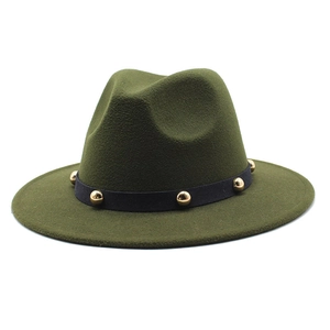 Detail of green wool fedora with black ribbon band and gold metal stud accents