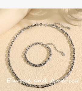 Detailed top view of silver Cuban link jewelry set featuring necklace and bracelet