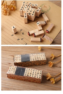 Detail showing 40pcs wooden typewriter stamp set with ink pad and various symbols