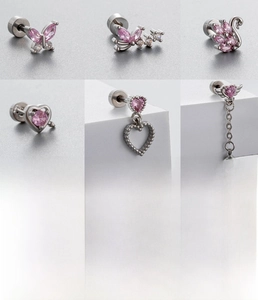 Detailed view of titanium steel stud earrings featuring butterfly and heart zircon designs