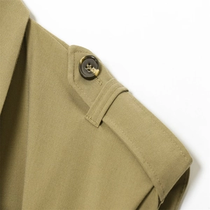 Detail shot of shoulder epaulettes and marbled button on khaki sleeveless jumpsuit