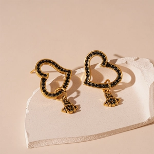 Retro golden heart and black zircon Saturn drop earrings with vintage aesthetic