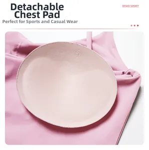 Detail showing pink yoga bra with removable round pads and soft brushed texture