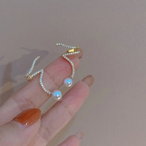 Elegant gold spiral crawler earrings with sparkling crystals and a white round pearl