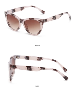Detail view of pink marble cat-eye sunglasses with brown gradient lenses from side and back