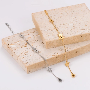 Detail of gold and silver star bracelets featuring sandblasted and polished finishes