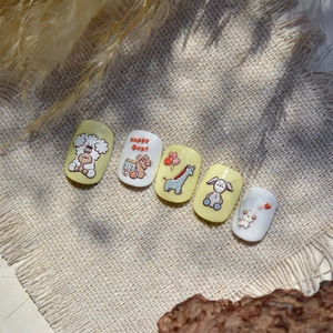 Cute embossed animal nail stickers featuring hand-drawn dogs and bears on beige background