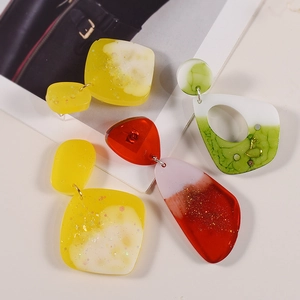 Handmade geometric resin earrings with glitter and gold hooks in various stylish shapes