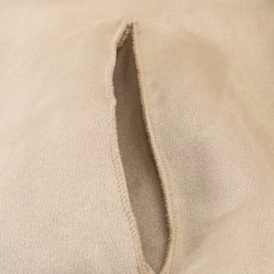 Detailed macro view of khaki suede fabric with reinforced lockstitch and precision seam