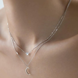 Double-layered S925 silver necklace with sparkling zircon moon and star pendants