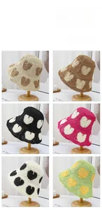 Detailed grid view showing six colors of woven straw hats with heart patterns and wide brims