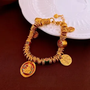 Gold-plated Fu character bracelet with vintage religious pendants on a red background