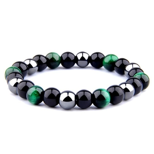 Macro detail of 8mm green tiger eye, obsidian and hematite beads on a yoga energy bracelet