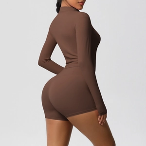 Detail view of the deep brown long sleeve top and high waist shorts for yoga