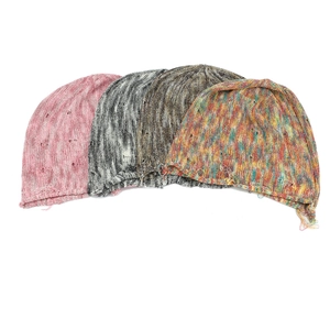 Detailed knit texture of colorful beanies featuring distressed ripped hole design elements