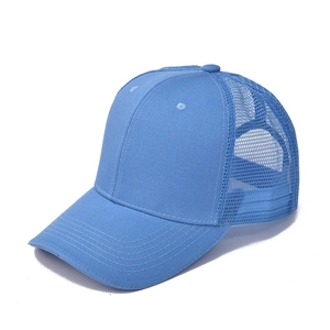 Detail view of light blue mesh trucker hat showing breathable texture and durable cotton fabric