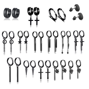 Detailed view of black punk earring set featuring skull, spider and cross designs
