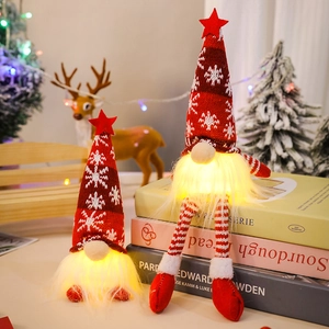 Illuminated Christmas gnome with knitted hat and long legs for festive home decoration