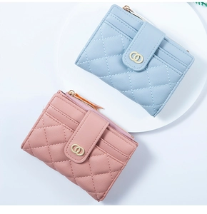 Detail view of quilted PU leather card holders with gold metal zipper and multi-card slots