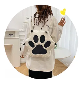 Close-up of fluffy white cat paw plush backpack with black soft toe pads detail