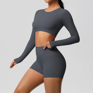 Close-up of dark grey high-elastic yoga set with long sleeve crop top and sports shorts