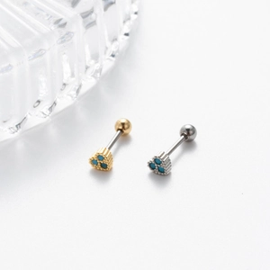 Macro view of stainless steel cartilage studs with blue stones and screw back closures